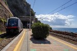 A Hitachi "Rock" EMU departs  for Manarola for points South 